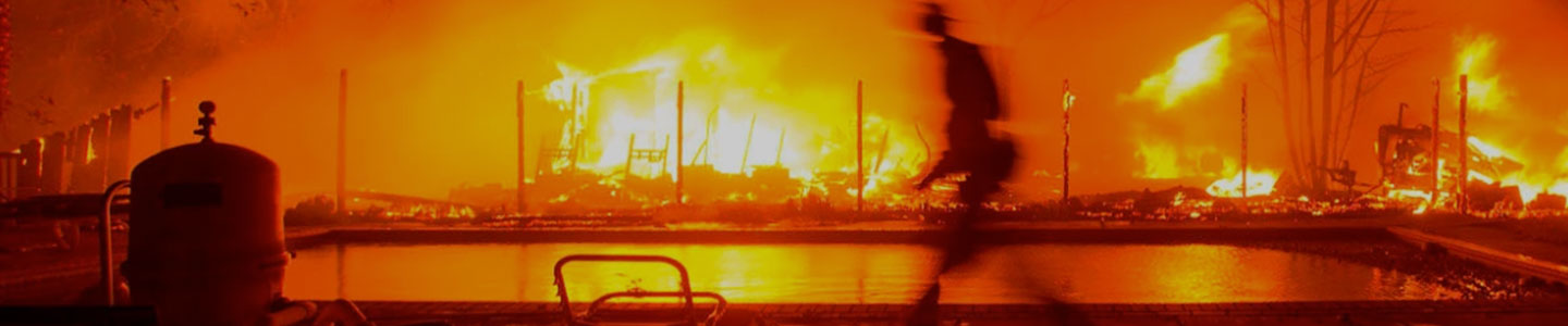 raging fire burning down structure