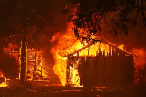 A house is fully engulfed by flames at the Dixie Fire, a wildfire near the town of Greenville, California, U.S. August 5, 2021. REUTERS/Fred Greaves